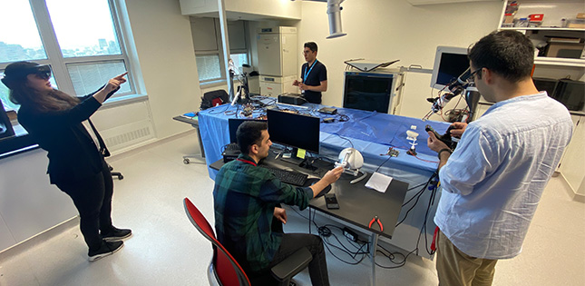 Graduate students and trainees conducting research at the Surgical Robotics Centre within the Clinical Innovation Platform