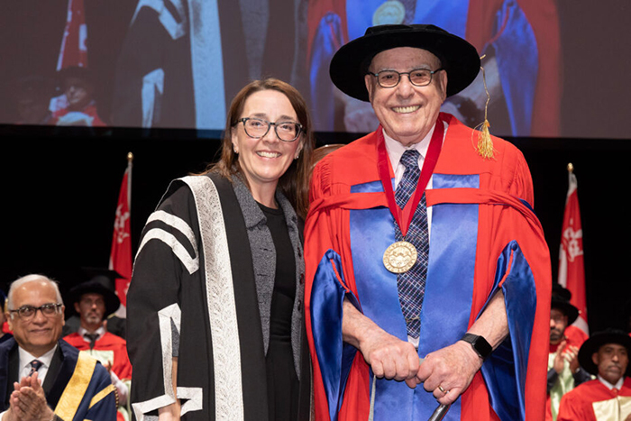 Dr. Phil Gold receives the McGill Medal from Angela Campbell, co-Acting Provost and Assistant Provost. Credit: Owen Egan / Joni Dufour