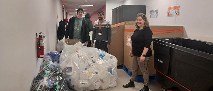 The external partner MultiRecycle collects recyclable waste at the RI-MUHC approximately every six weeks. Pictured (from left): Benjamin Brossaud (MultiRecycle representative), Ali Salim (Technical Services) and Severine Audusseau (Translational Research in Respiratory Diseases Program).